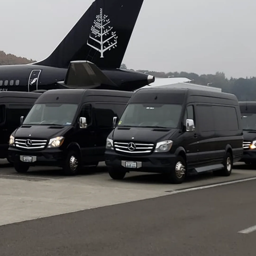 black mercedes limousine vans on runway